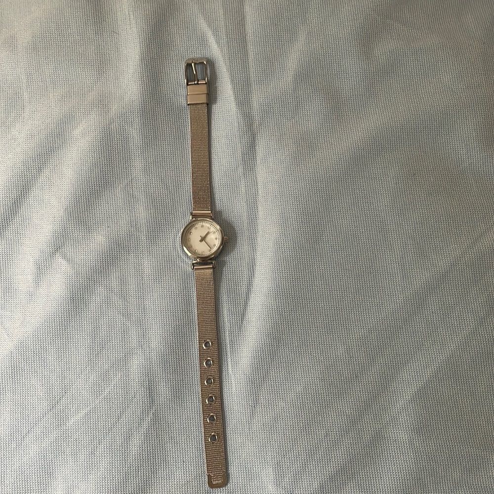 Silver watch by AccuTime watch corporation with diamond accents for each number